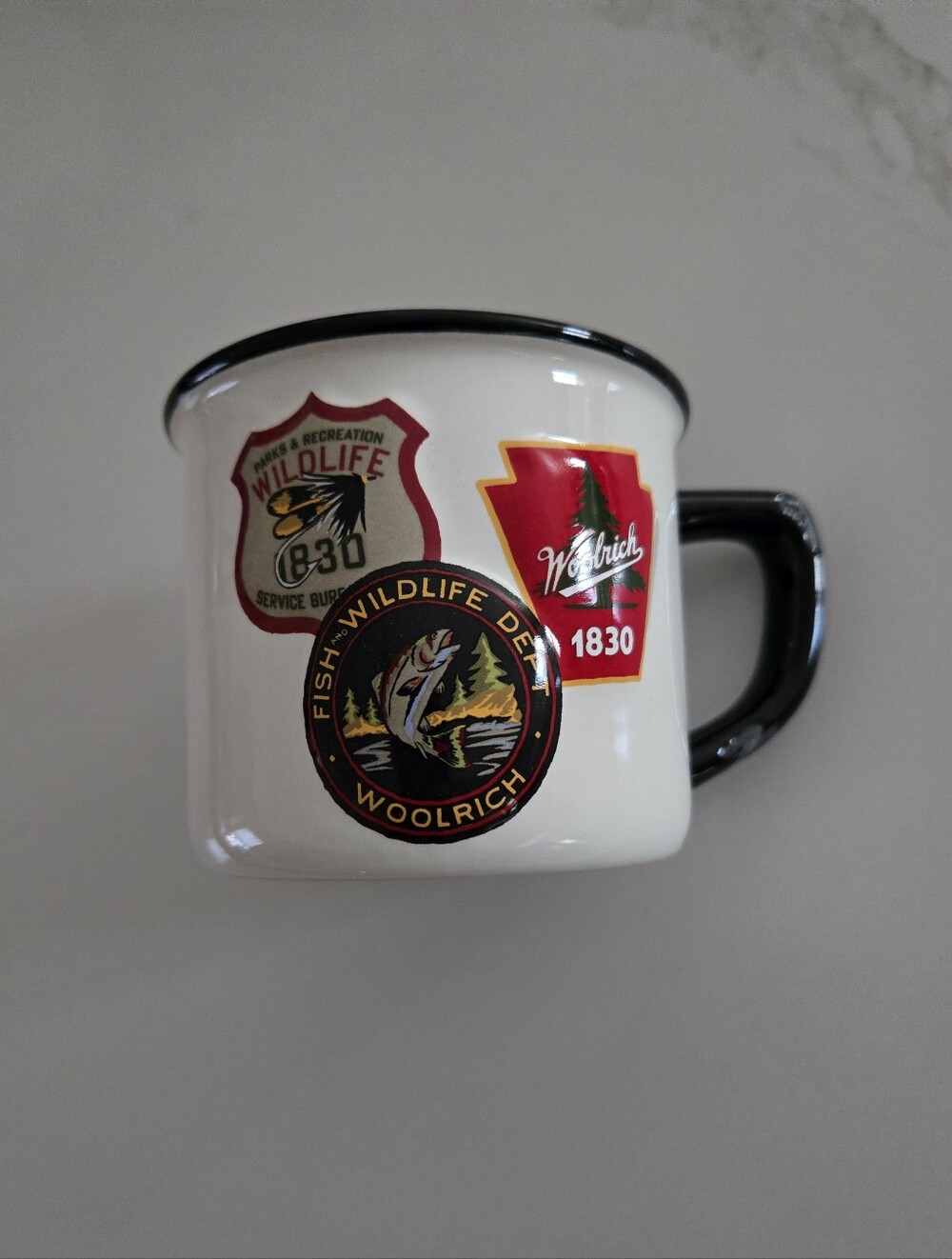 Woolrich White Ceramic Camping Mug with Black Rim and Handle, Red and Gold Logos